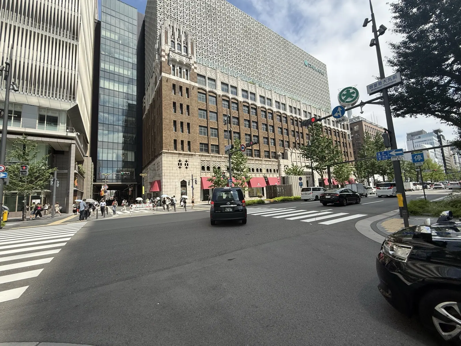 The ornate 1933 Art-Deco facade of the Daimaru Shinsaibashi department store in Osaka, seen across a busy intersection