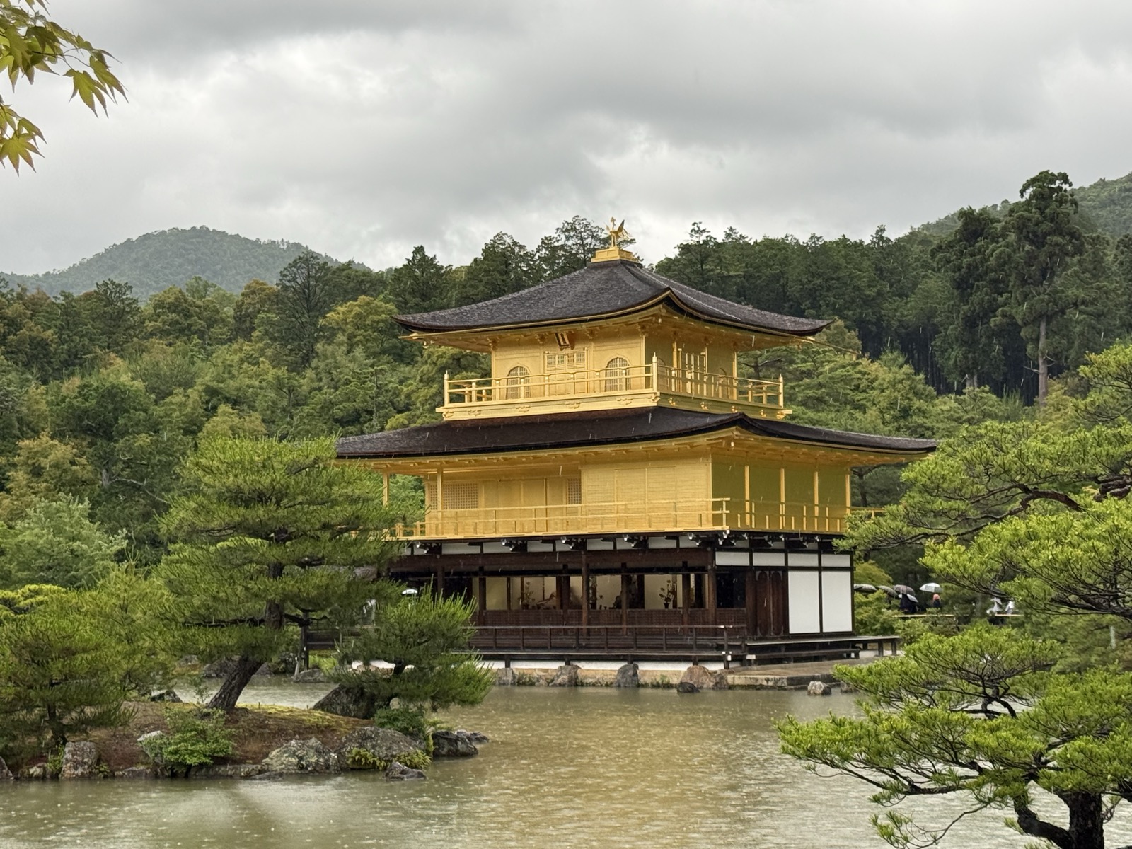 Kinkaku-ji, the Golden Pavilion, mirrored in its pond in Kyoto — our own photo