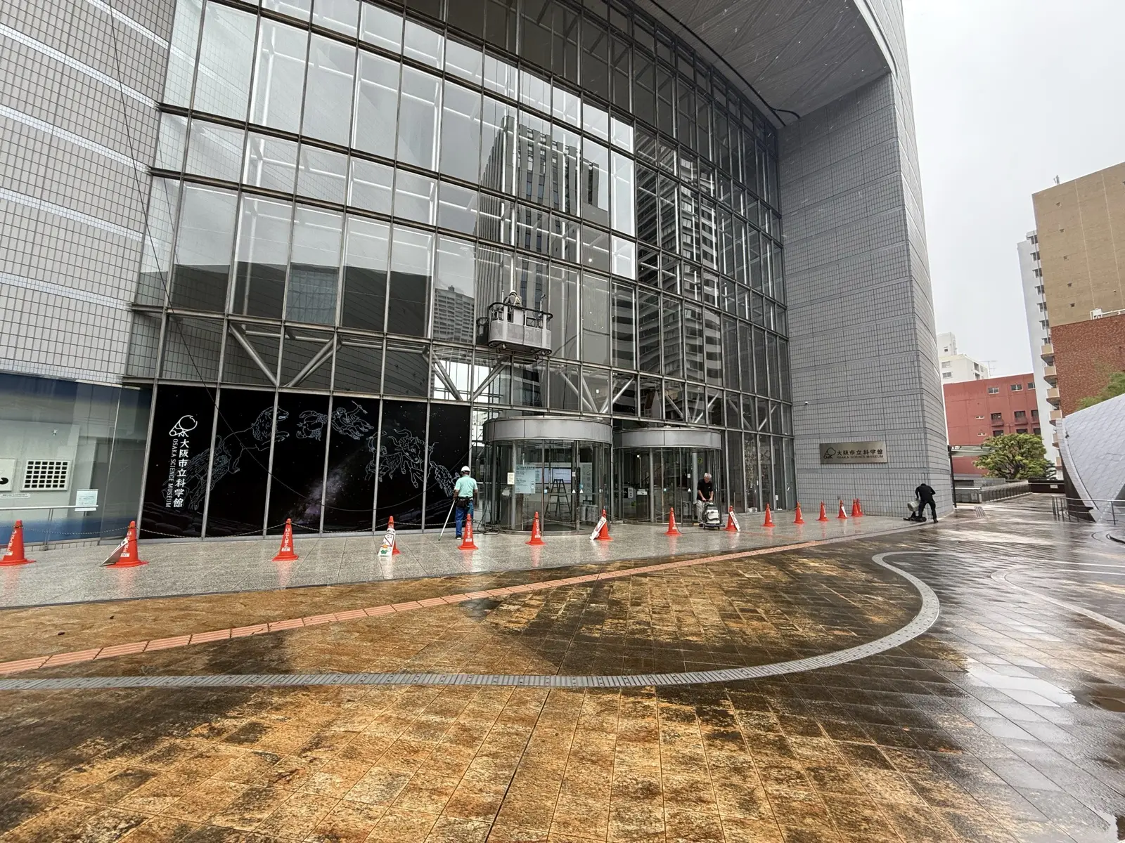 The Osaka Science Museum entrance with its glass facade and sign