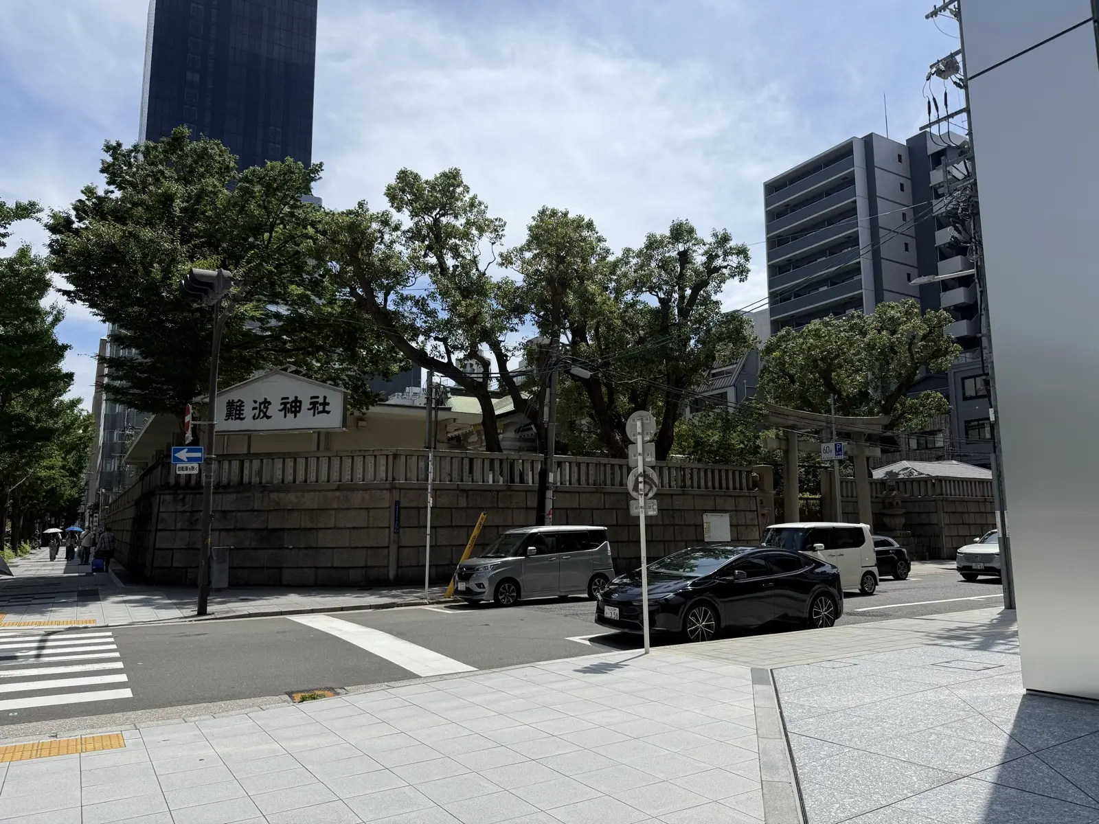 Namba Shrine, a green grove of trees and a shrine gate tucked among the office towers along Midosuji in central Osaka